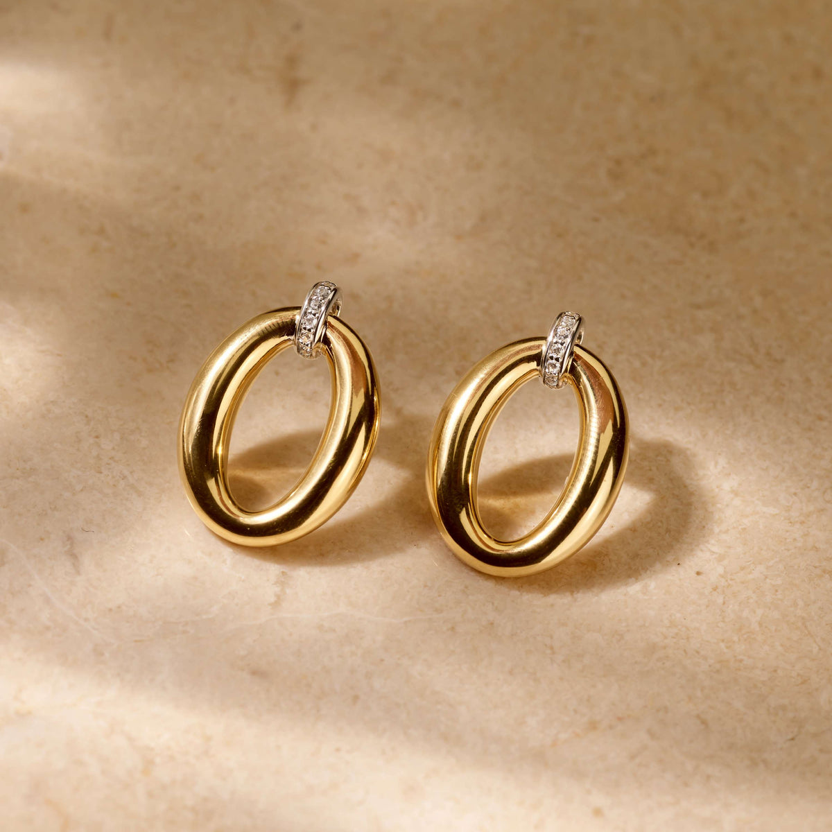Gold Vermeil soft oval drop earrings with cubic zirconia, styled