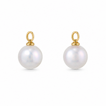 Load image into Gallery viewer, A pair of gold ear charms featuring a single round white pearl drop on each, set against a plain white background.