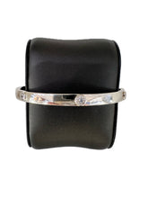 Load image into Gallery viewer, Sterling Silver and round rubover set cz Hinged Bangle