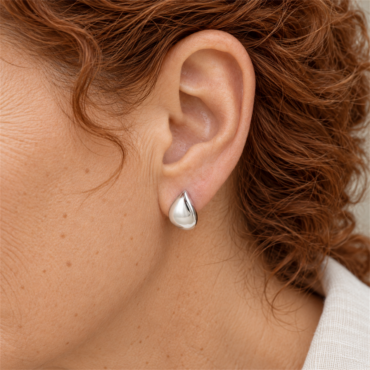 Sterling Silver Teardrop Stud Earrings worn by the Urban Armour model