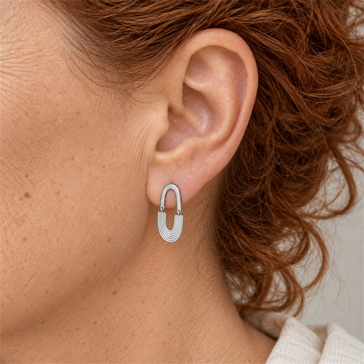 Sterling Silver Art Deco Arc Drop Earrings worn by the Urban Armour model