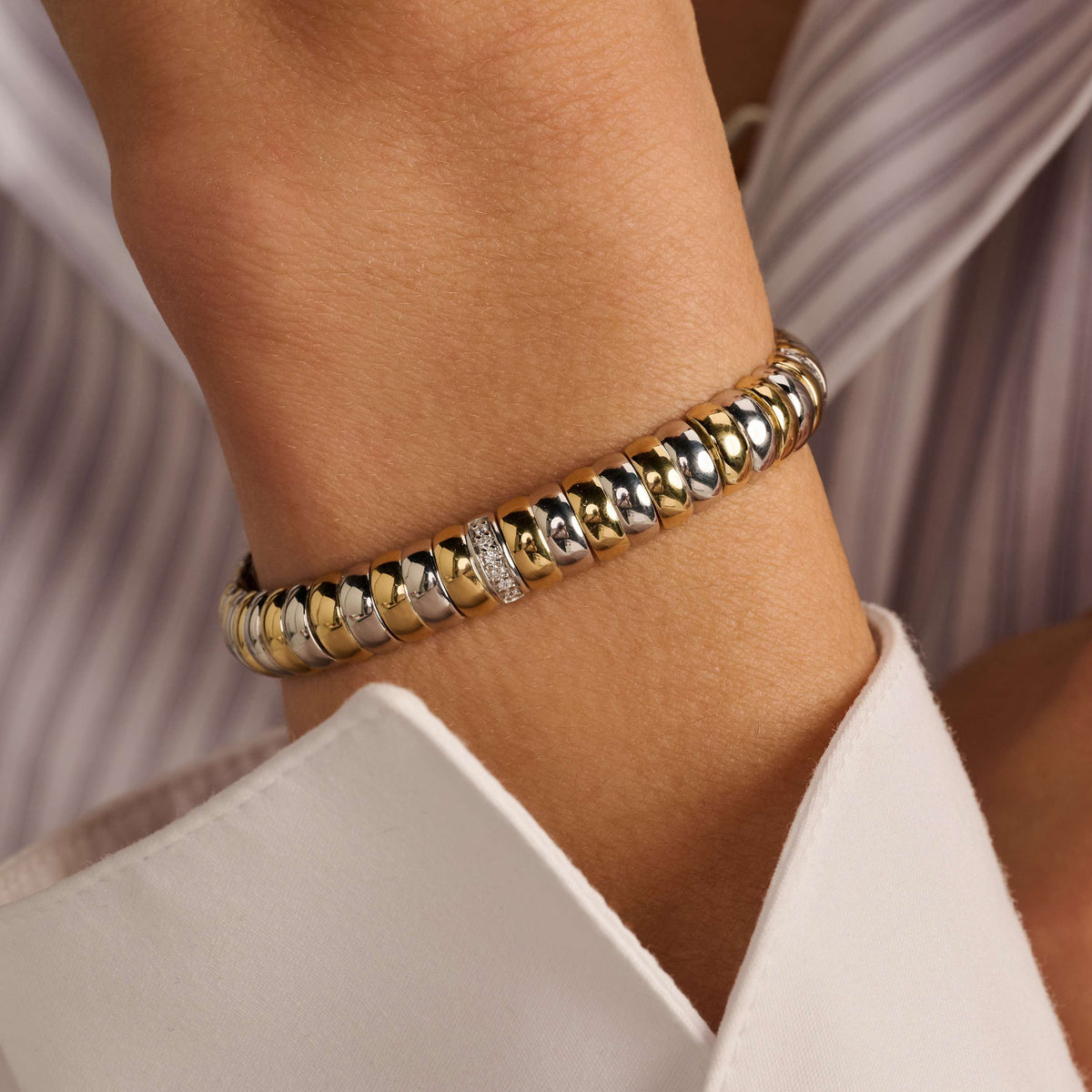 Gold Vermeil and Sterling Silver Two Tone link bracelet with cubic zirconia, styled