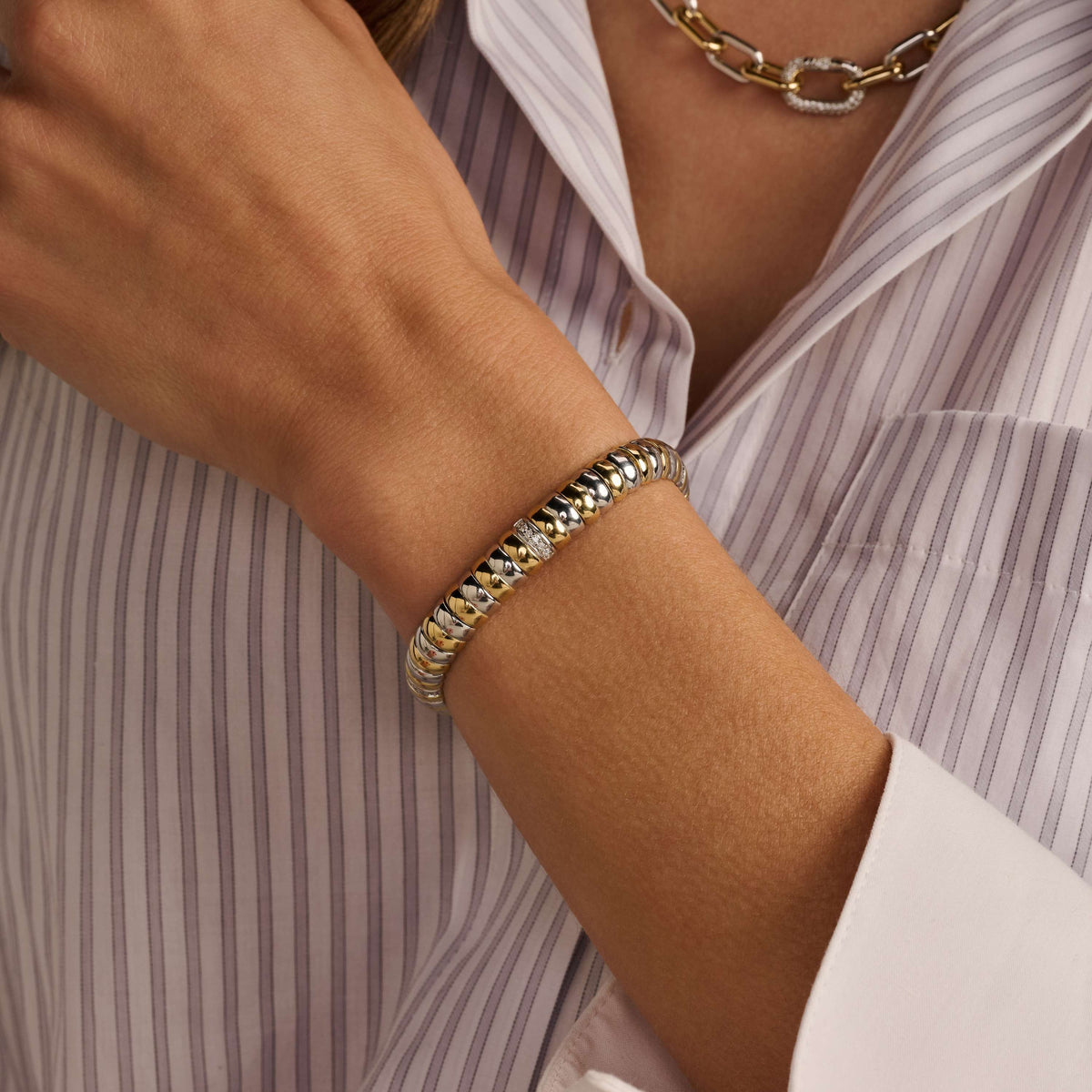 Gold Vermeil and Sterling Silver Two Tone link bracelet with cubic zirconia, styled