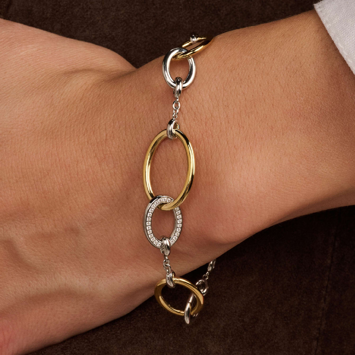 Gold Vermeil and Sterling Silver connected circle bracelet with cubic zirconia, styled
