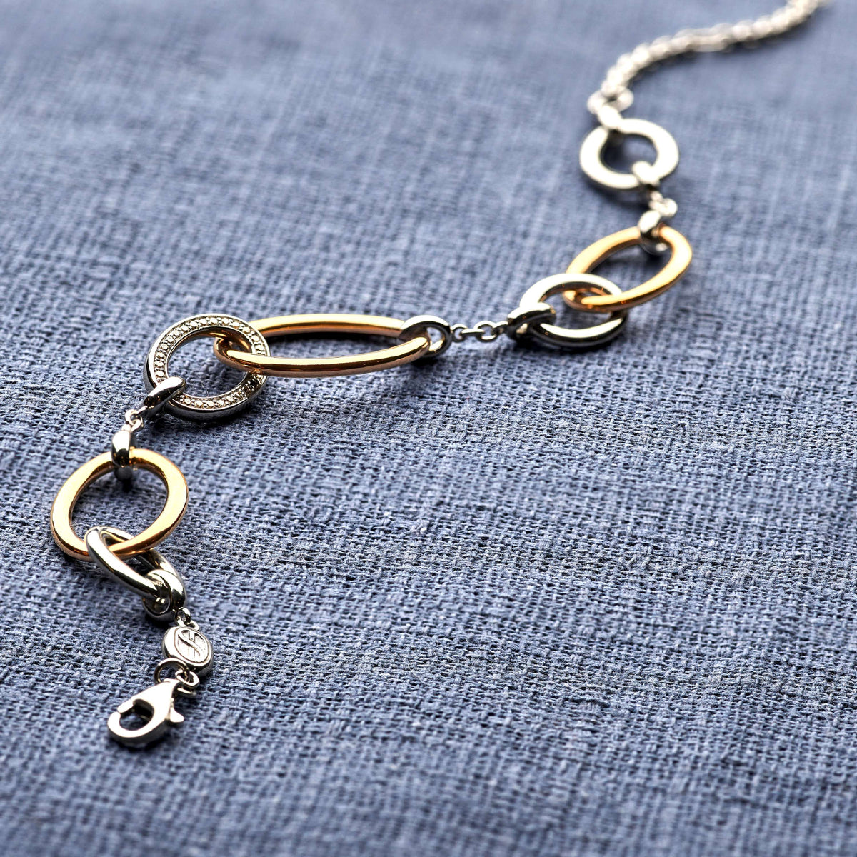 Gold Vermeil and Sterling Silver connected circle bracelet with cubic zirconia, styled