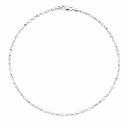 A silver beaded chain necklace arranged in a circle on a plain white background.