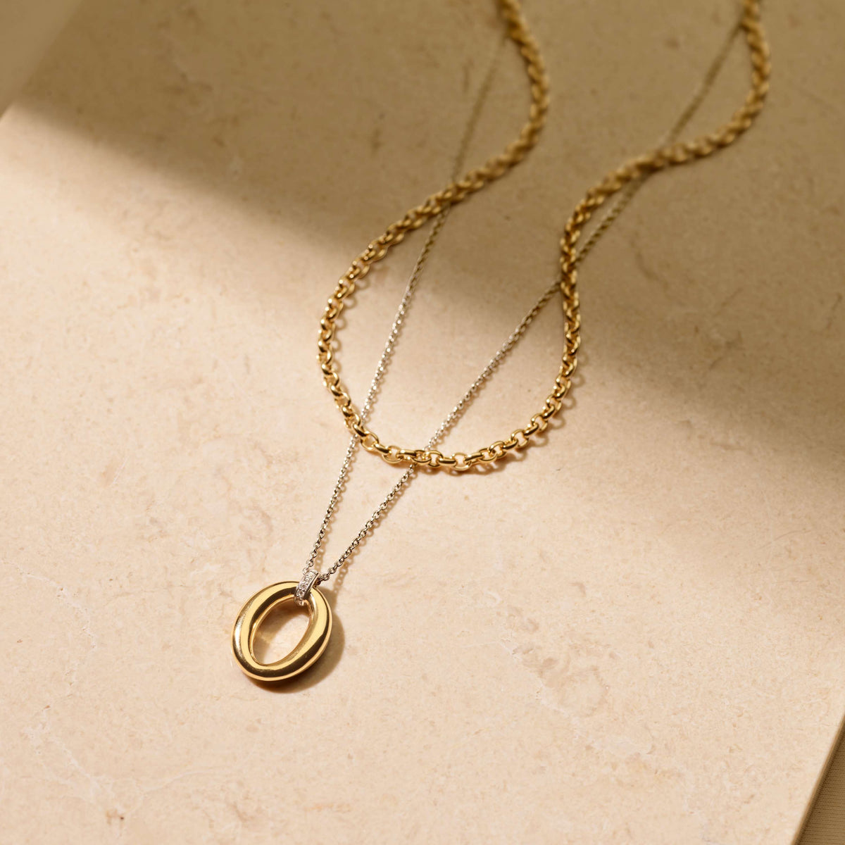 Gold Vermeil soft oval pendant on Sterling Silver chain, styled