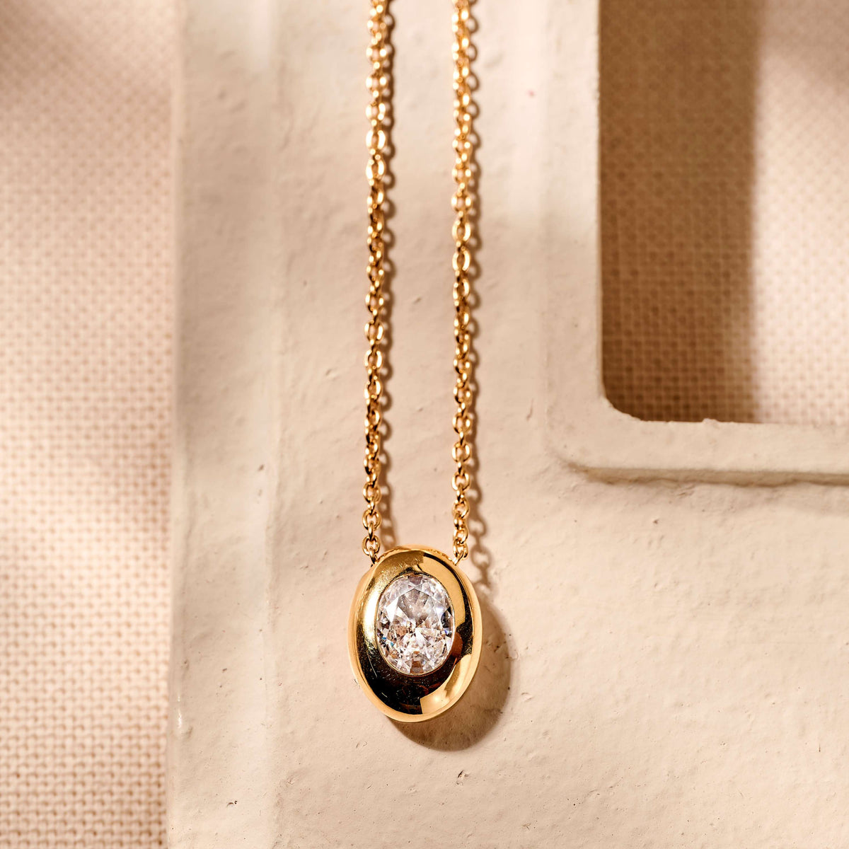 Gold Vermeil oval cubic zirconia pendant, styled