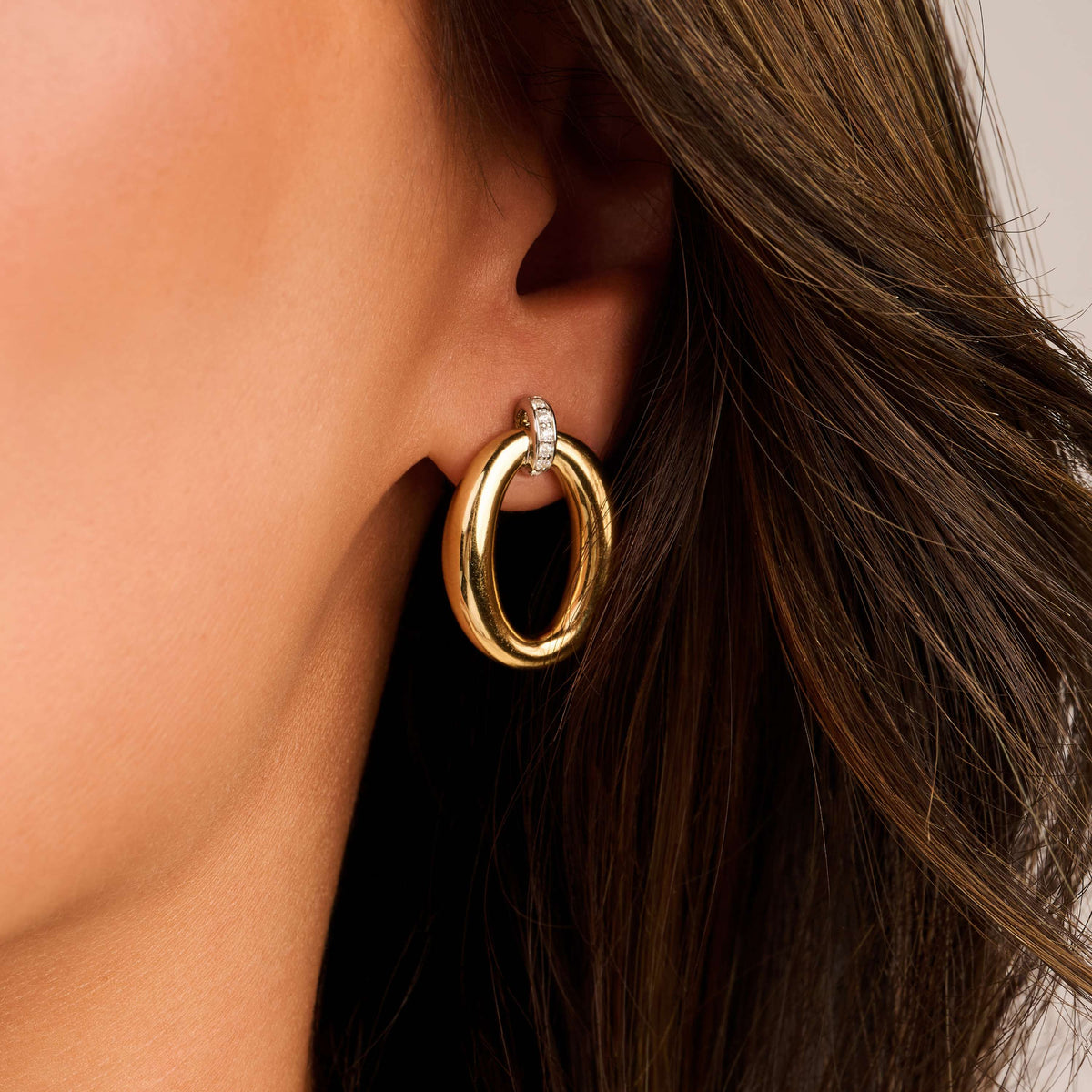 Gold Vermeil soft oval drop earrings with cubic zirconia, styled