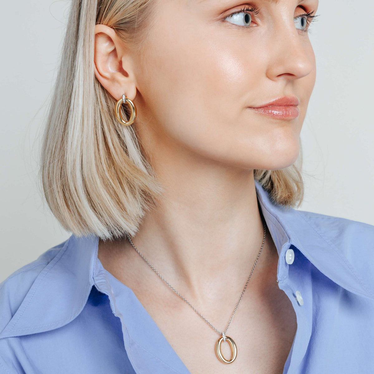 Gold Vermeil soft oval drop earrings with cubic zirconia, styled