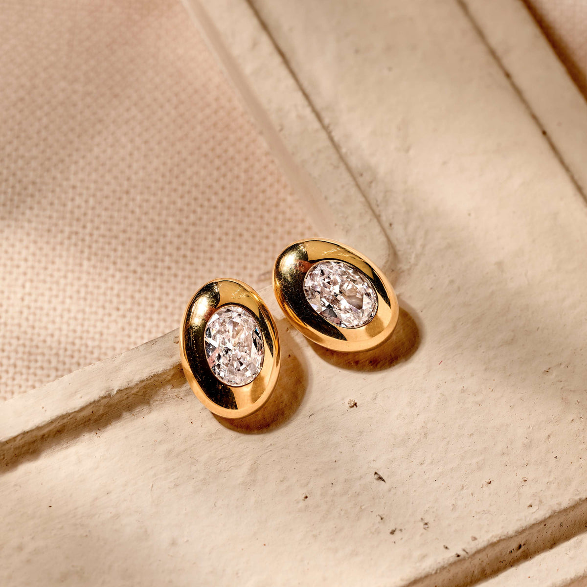 Gold Vermeil oval cubic zirconia stud earrings, styled