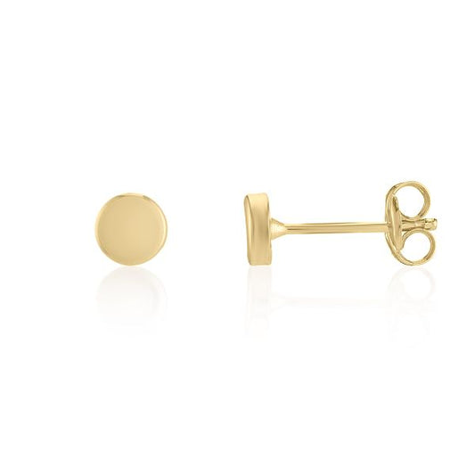 A pair of yellow gold stud earrings, one shown from the front as a flat round disc and the other from the side showing the post and butterfly back, on a white background with a soft reflection.