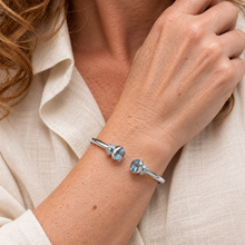 Load image into Gallery viewer, Sterling Silver Blue Topaz and Cubic Zirconia Hinged Torq Bangle
