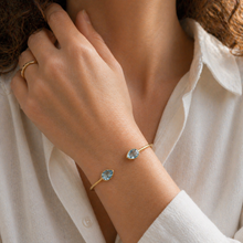 Load image into Gallery viewer, Gold Vermeil Blue Topaz Torque Bangle
