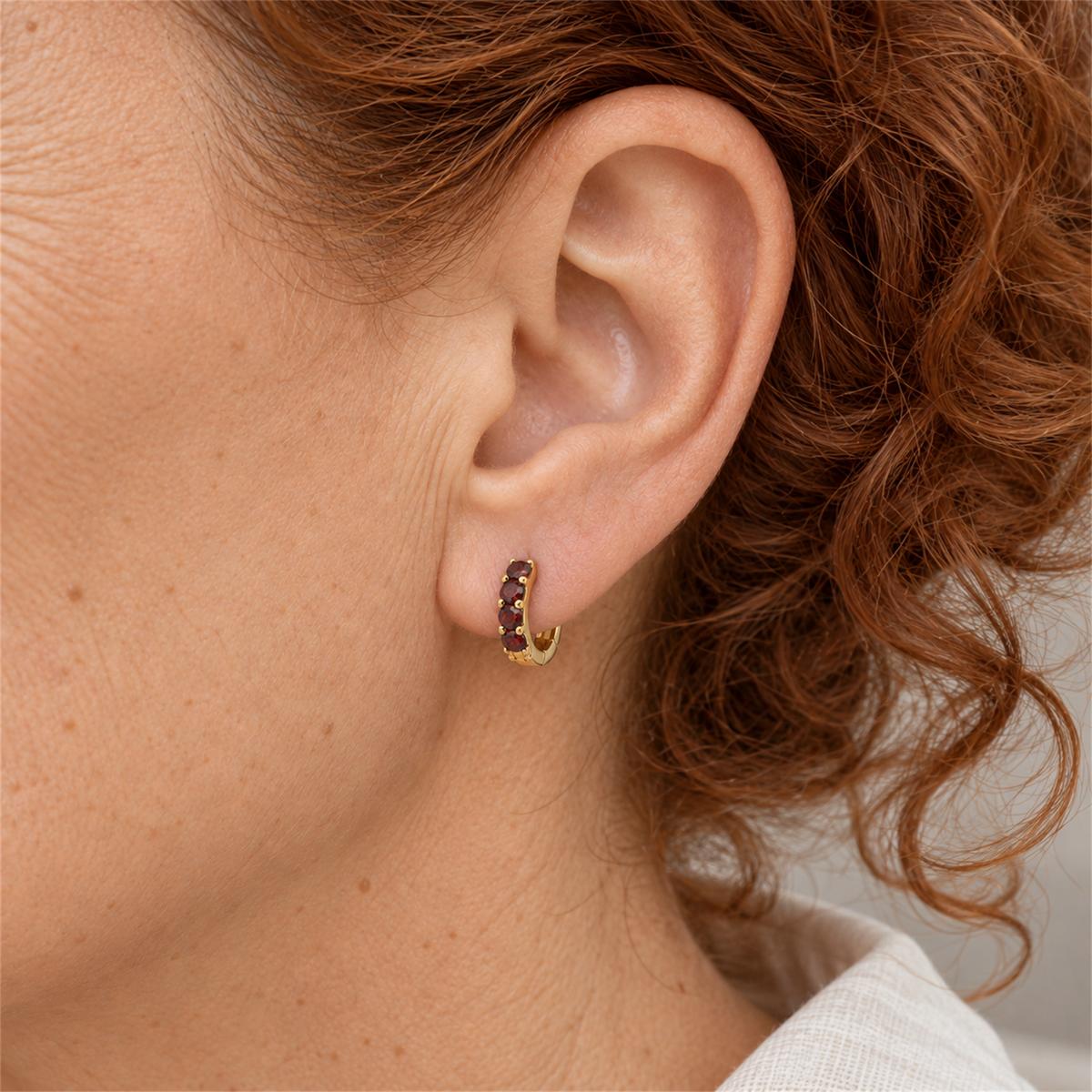 Gold Vermeil Ruby Colour Cubic Zirconia Huggie Earrings worn by the Urban Armour model