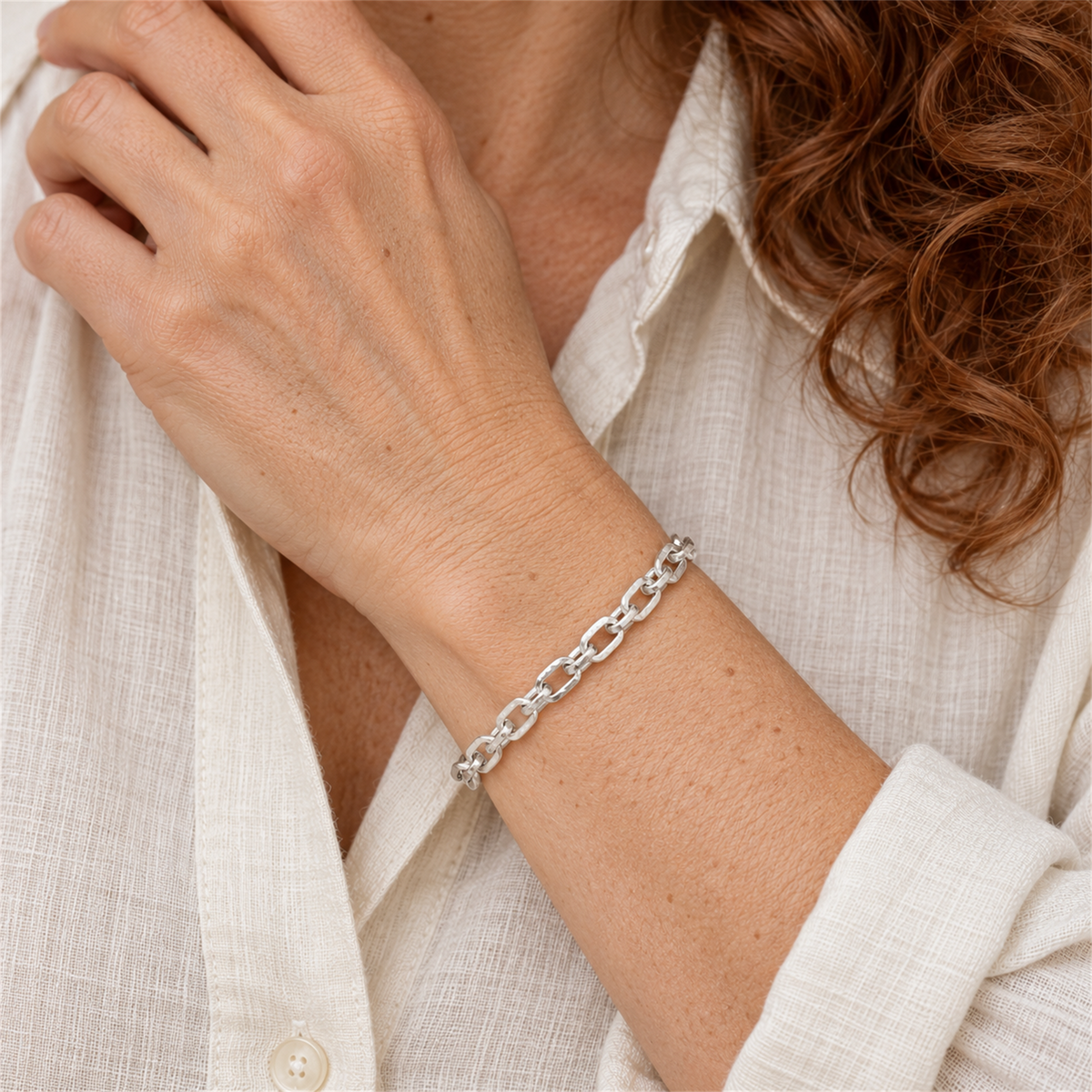 Sterling Silver 7.71mm Hammered Trace Bracelet worn by the Urban Armour model with cream linen shirt