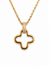 Load image into Gallery viewer, A gold necklace featuring an open quatrefoil pendant with a pavé-set accent at the top, displayed on a clean white background.
